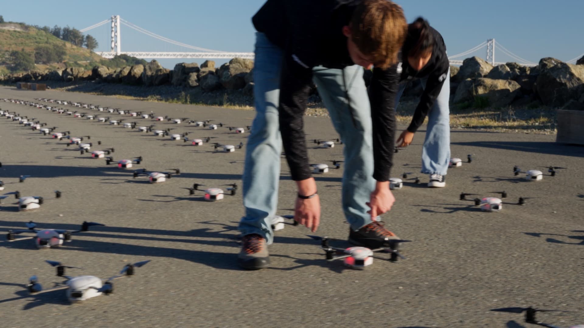 Crew hand-placing drones on the launch grid